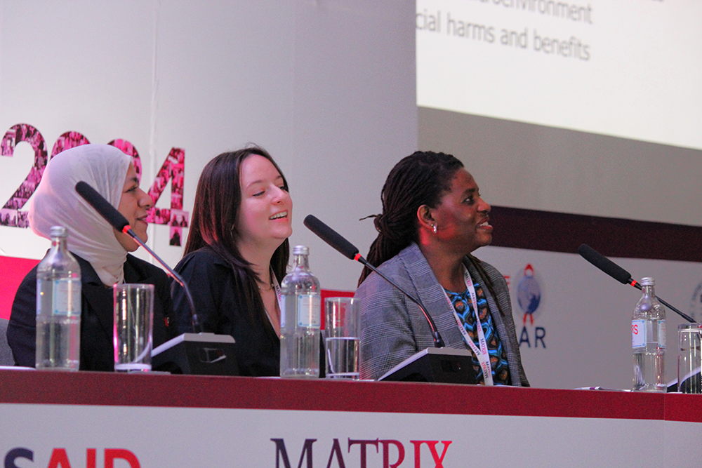 Panelists listening to a presentation