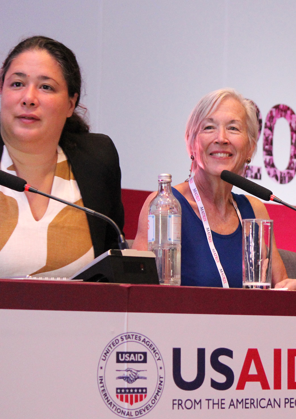 Panelists listening to a presentation