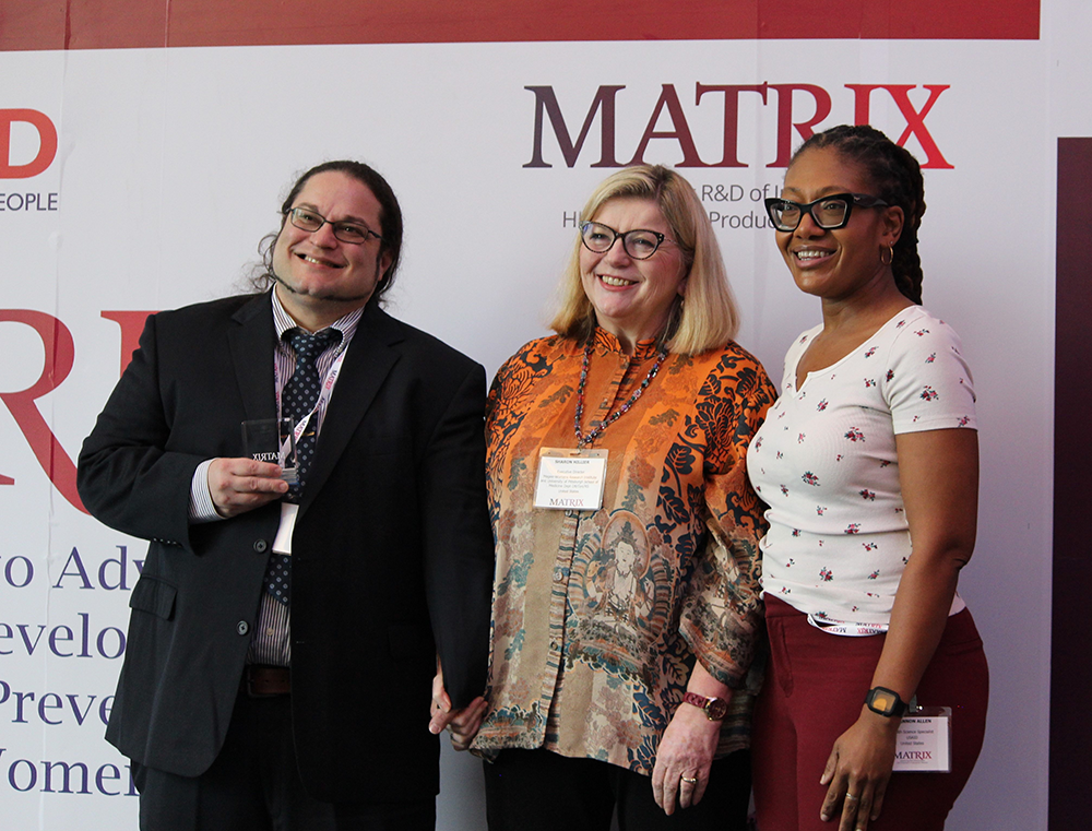 A group posing for a picture during a meeting