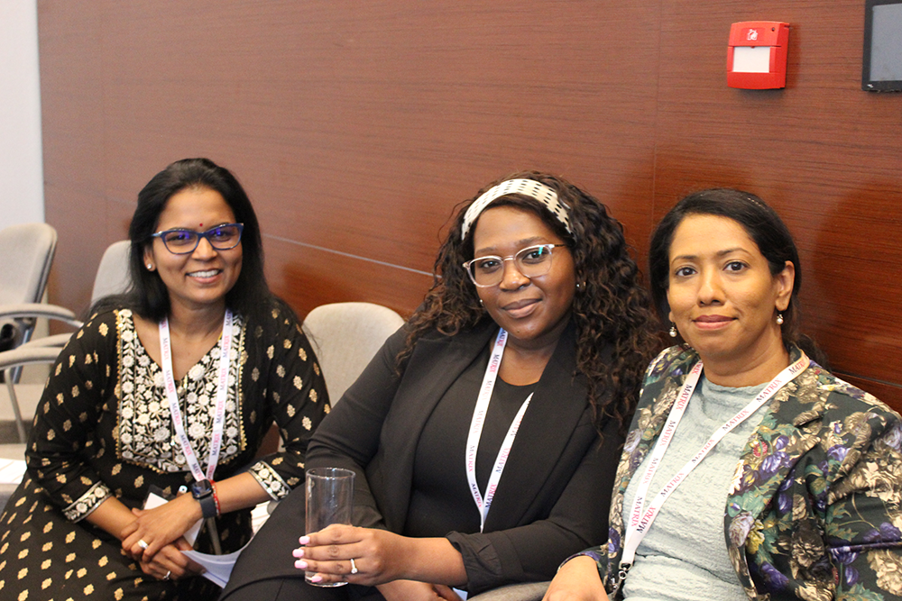 A group posing for a picture during a meeting