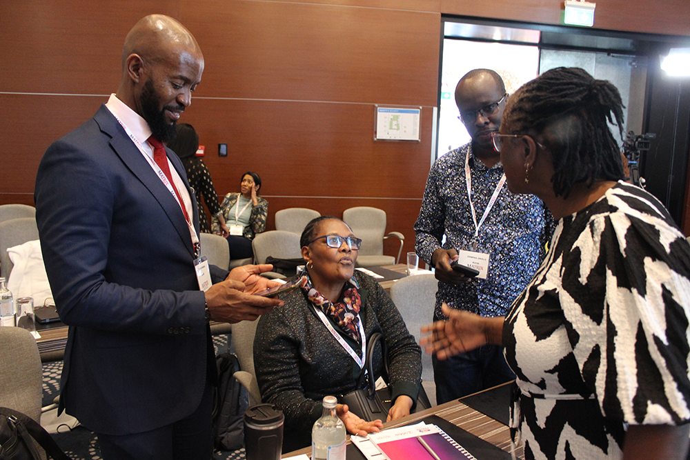 Members of the audience conversing during a break