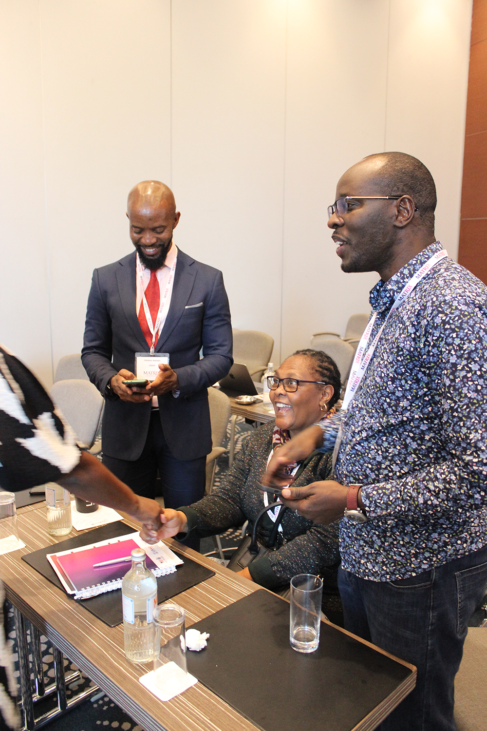 Members of the audience conversing during a break