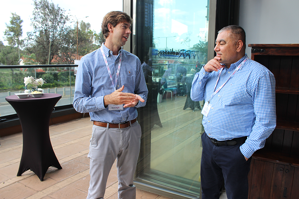 Two people conversating during a meeting break